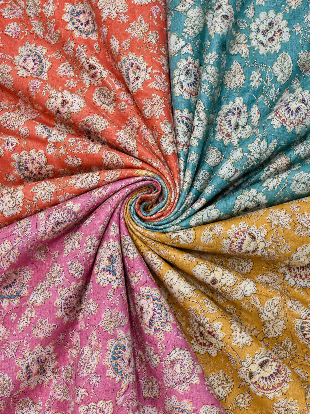 Swirl of colorful floral fabric in red, blue, pink, and yellow.